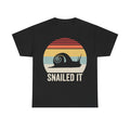 T-shirt with retro sunset snail graphic on black, featuring SNAILED IT.