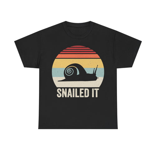T-shirt with retro sunset snail graphic on black, featuring SNAILED IT.