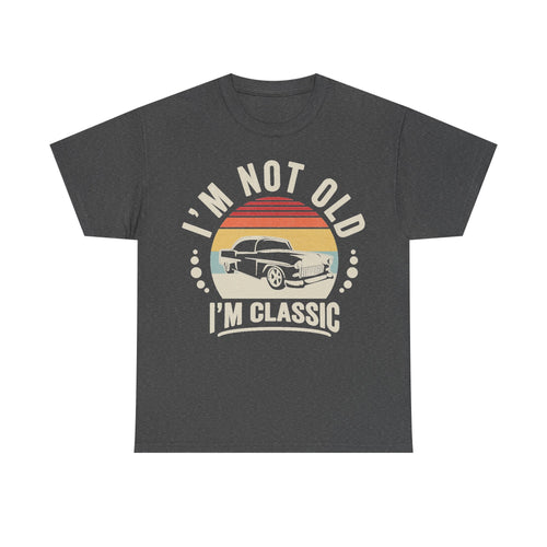 T-shirt in charcoal gray with a retro sunset circle and vintage car graphic, featuring the text I'M NOT OLD I'M CLASSIC