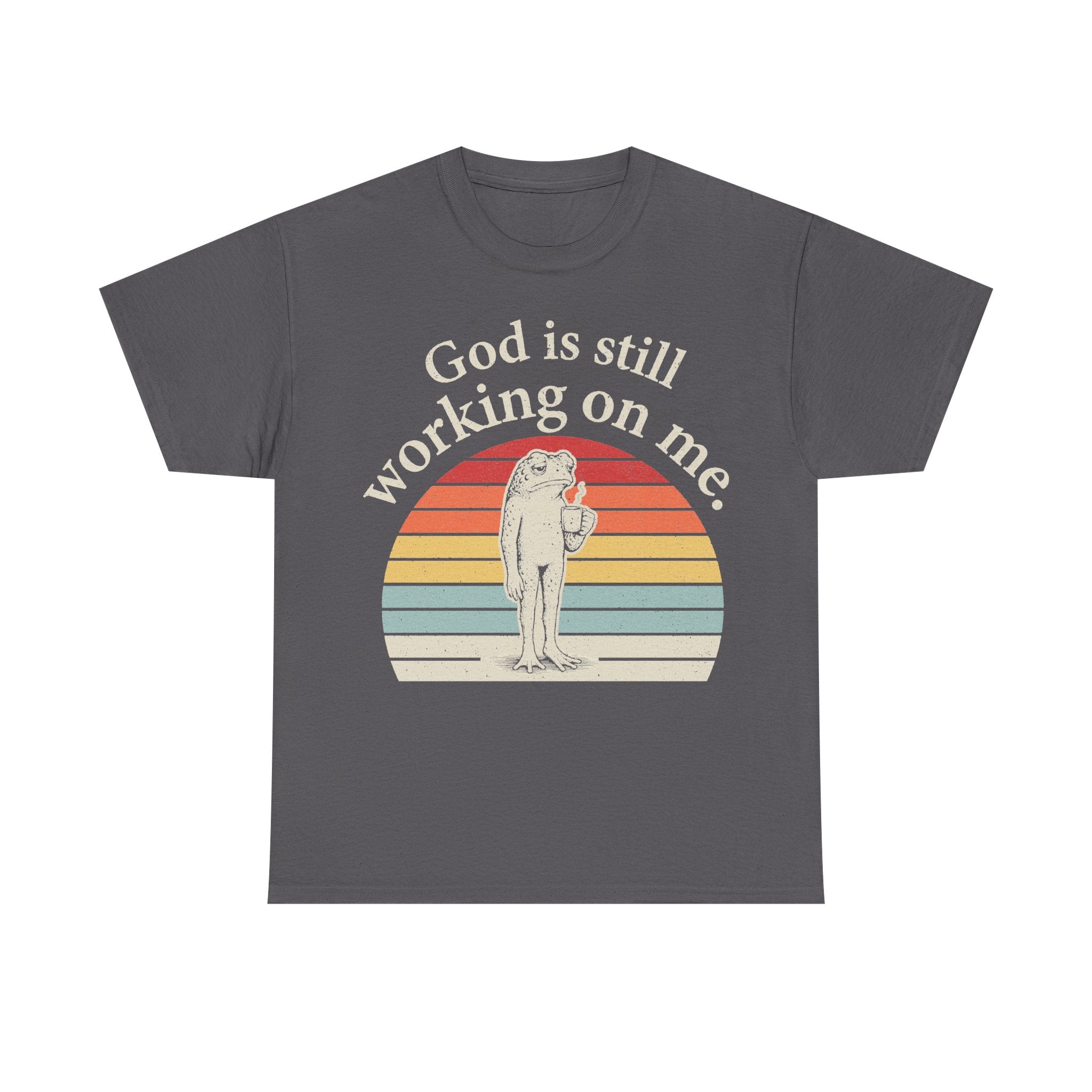 T-shirt gray with retro sunset circle frog graphic; God is still working on me.
