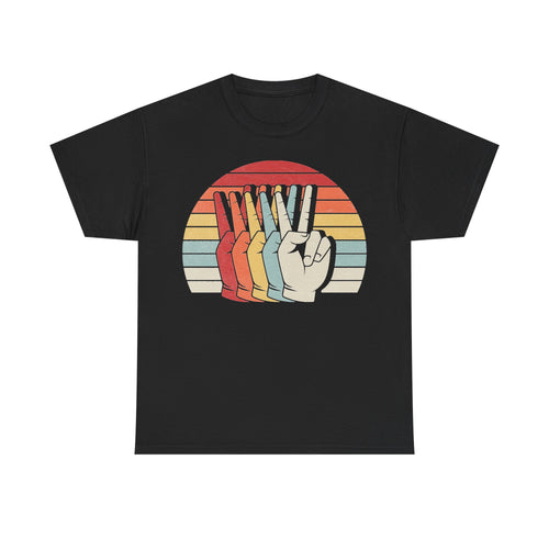 T-shirt with black background featuring a retro rainbow sunset circle and multicolored raised-fist graphic.