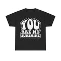 T-shirt in black with distressed white lettering YOU ARE MY SUNSHINE inside a cloud border.