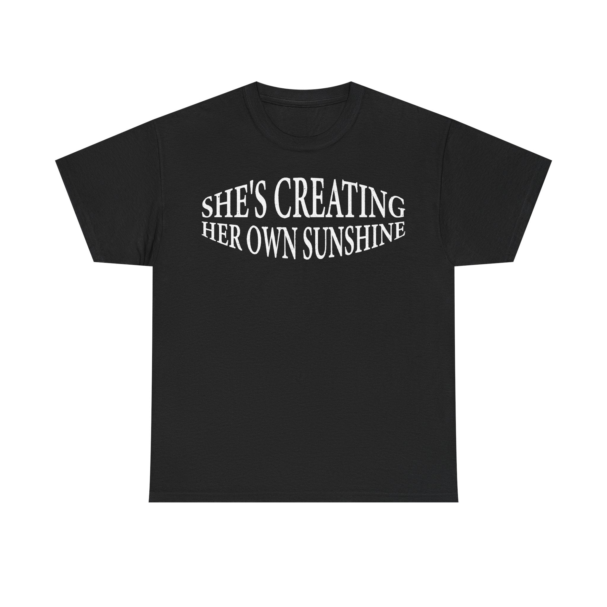 Black women's T-shirt with curved white text: She's Creating Her Own Sunshine, vintage typography.