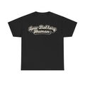 Black T-shirt with bold retro cream script reading Low Battery Human across the chest.