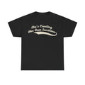 T-shirt in black with beige vintage script text She's Creating Her Own Sunshine across the chest.