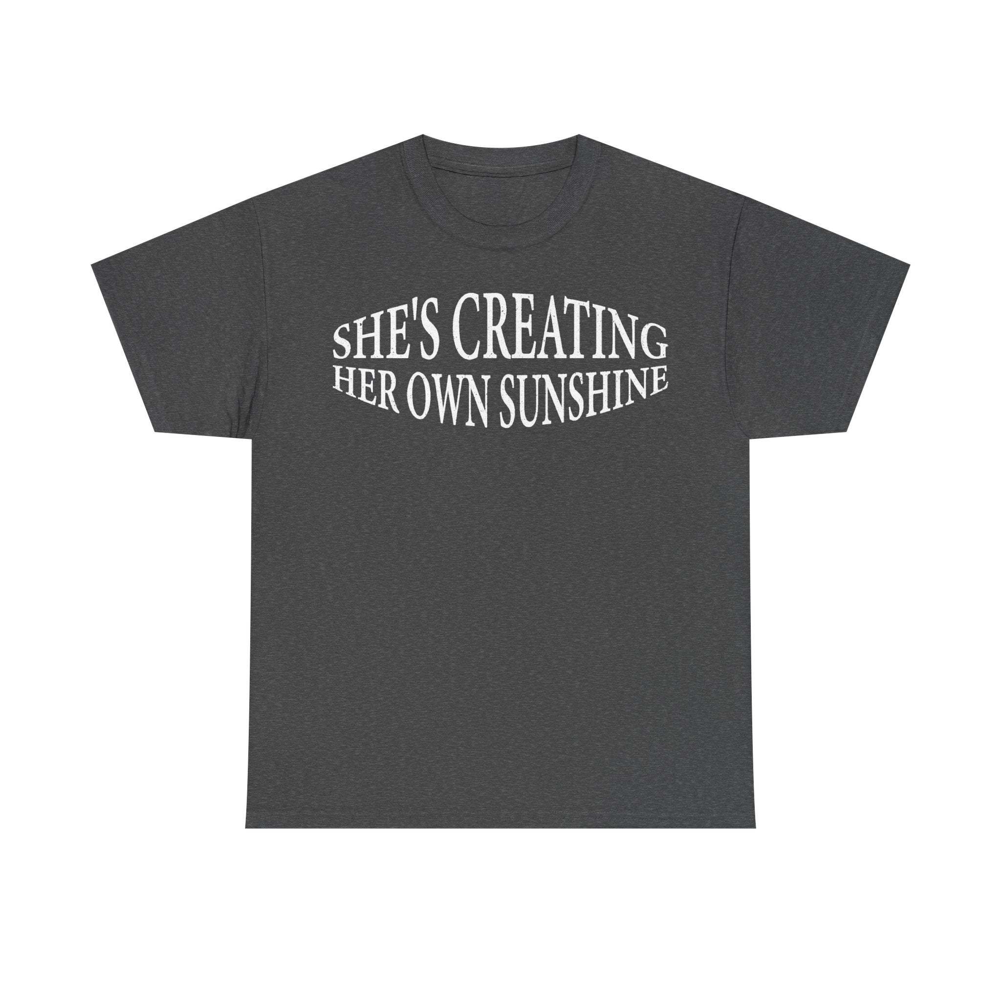 T-shirt with curved white typography reading SHE'S CREATING HER OWN SUNSHINE on charcoal gray fabric.