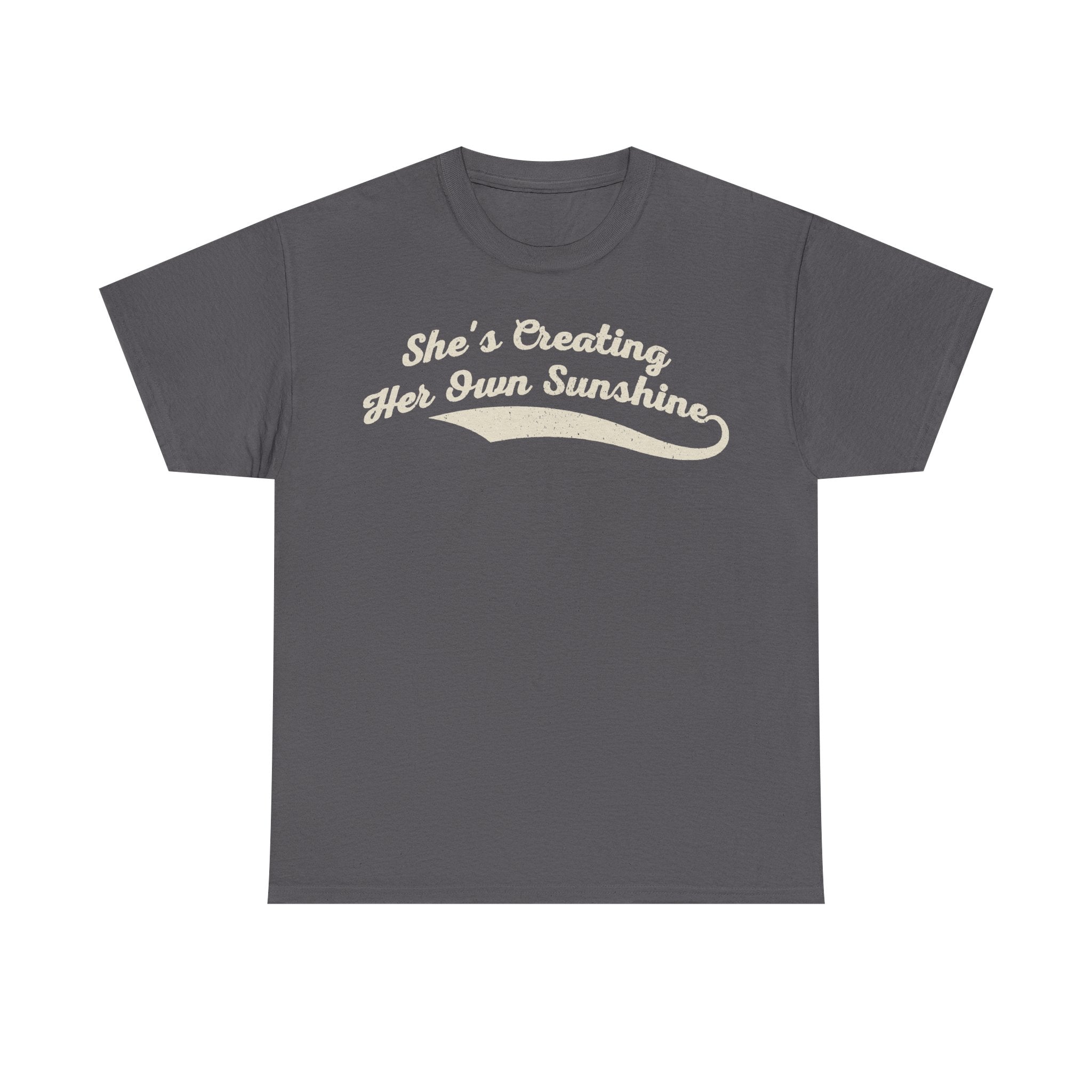 T-shirt in charcoal gray with cream retro script reading She's Creating Her Own Sunshine.