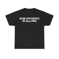 Black unisex T-shirt with bold white retro typography reading NO ONE EVER SUSPECTS THE Short ONES across chest