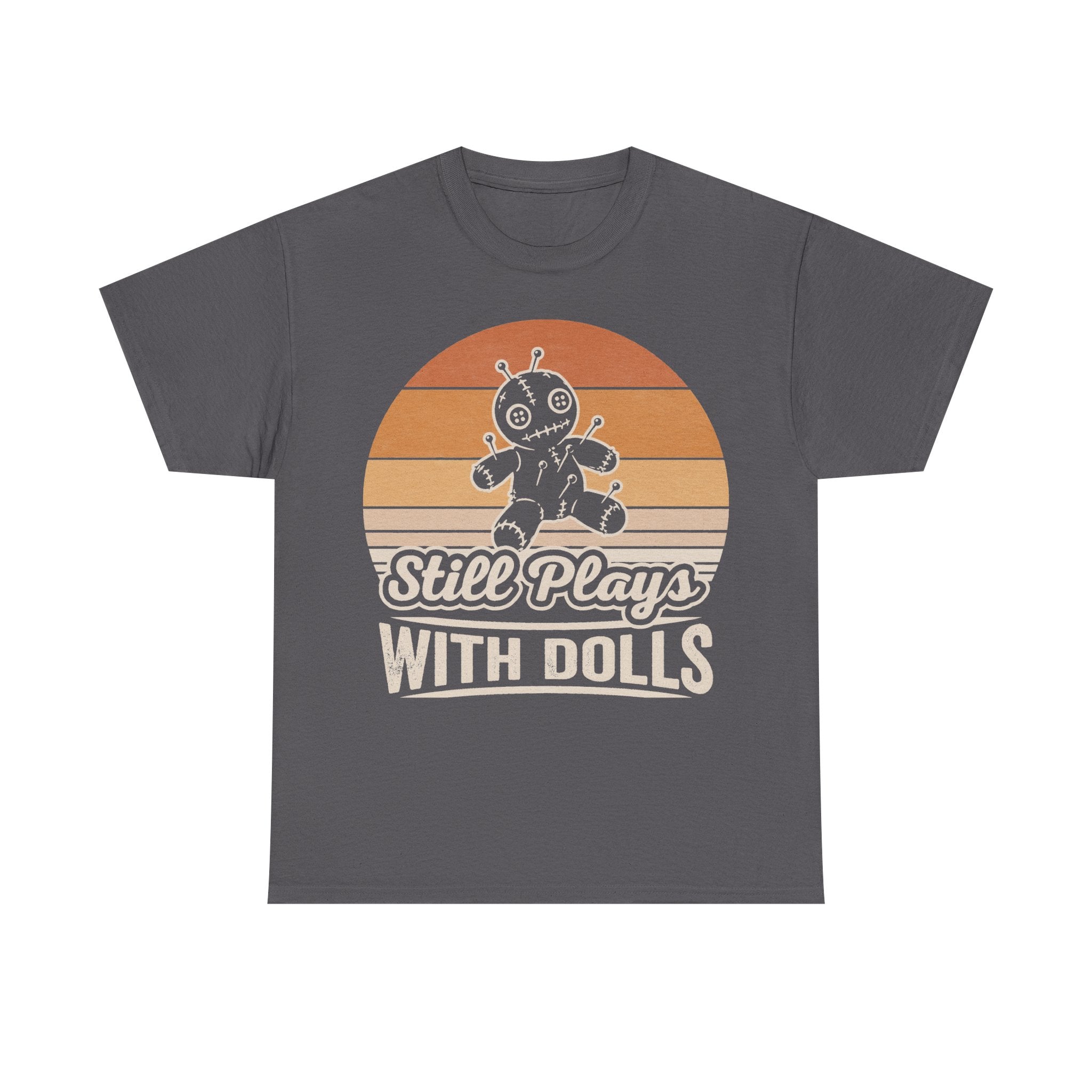 T-shirt with Still Plays With Dolls graphic on dark gray, featuring a retro sunset background and a stitched voodoo doll illustration.