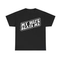 T-shirt with distressed white text MY WIFE BEATS ME on black fabric; retro vintage gag design