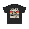 Black T-shirt with distressed cream text reading HAIR ONLY SLOW ME DOWN over vintage sunset stripes.