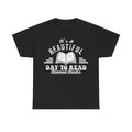 Black T-shirt with distressed white text It's A Beautiful Day To Read and an open-book graphic, retro vibe