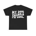 Black T-shirt with bold distressed white text MY DOG THINKS I'M COOL across the front