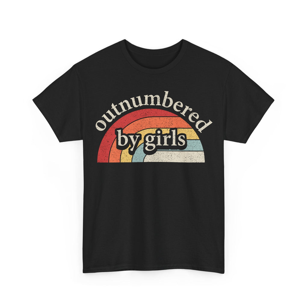 T-shirt on black fabric with a vintage rainbow arc and distressed typography reading outnumbered by girls
