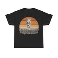 Black T-shirt with a retro orange sunset and frog illustration, along with the text i could be meaner but jesus said no