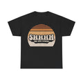 T-shirt with bold retro sunset graphic and SHHHH No One Cares text on black.