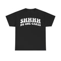 T-shirt black with distressed white print SHHH NO ONE CARES, bold retro typography on a casual everyday graphic tee