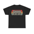 T-shirt, black with retro sunset arc graphic and bold distressed text SHHH NO ONE CARES on front